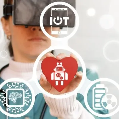 A person wearing a virtual reality (VR) headset holding a red heart model in their hand.